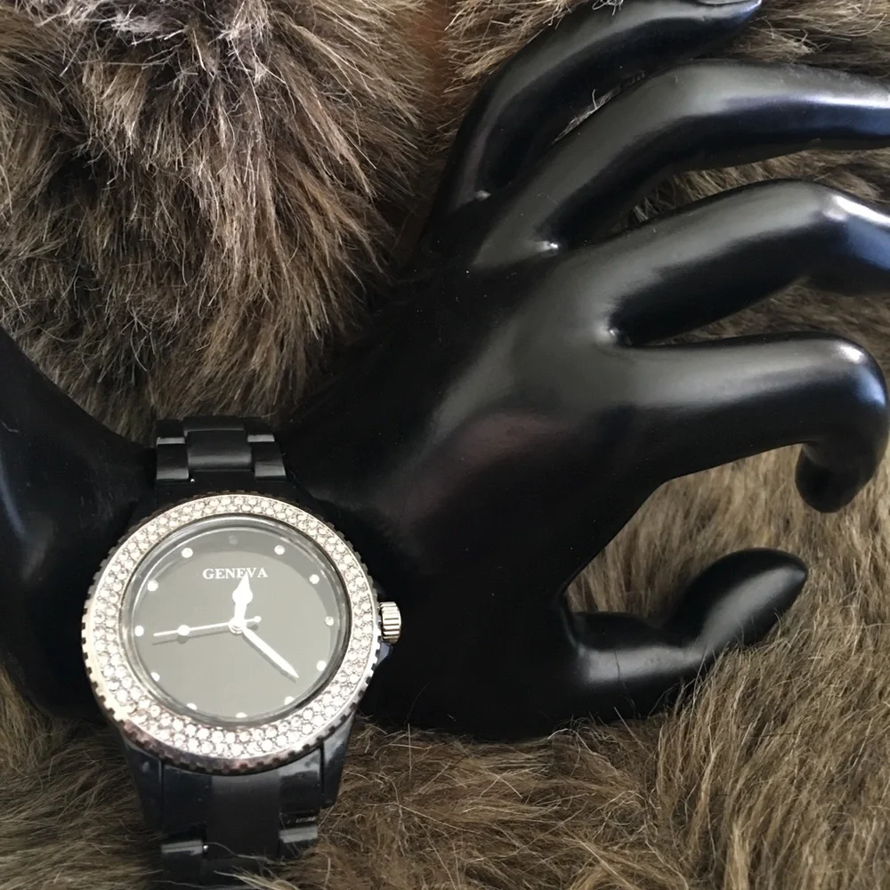 Ladies Geneva black plastic band rhinestone watch